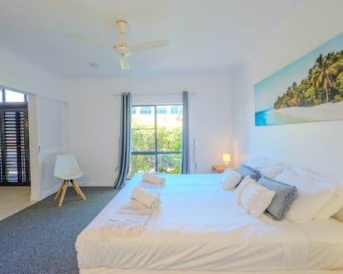 Spacious bedroom in a 1 or 2 bedroom courtyard apartment at Mango Lagoon Resort, Palm Cove Cairns