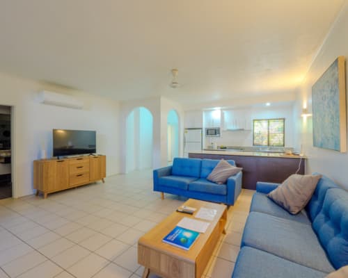 Lounge and kitchen area of an upper floor 1 or 2 bedroom apartment at Mango Lagoon Resort, Palm Cove Cairns