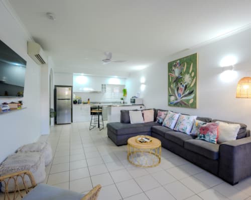 Lounge and kitchen area of an upper floor 1 or 2 bedroom apartment at Mango Lagoon Resort, Palm Cove Cairns